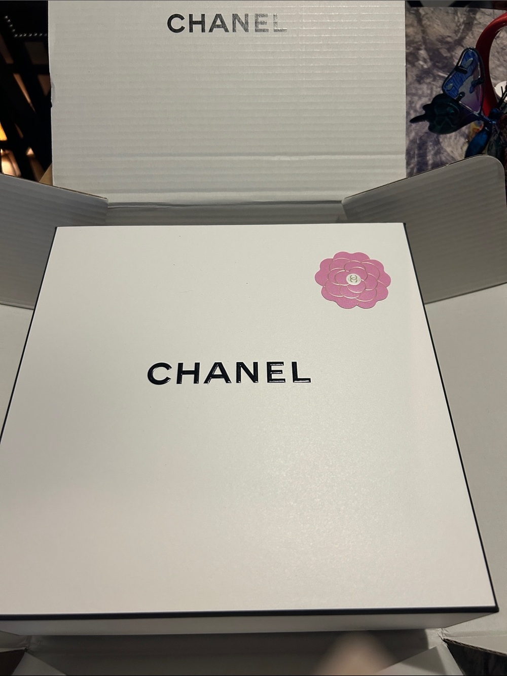 Three CHANEL White Boxes with Pink Camellia Accent on the larger inside box.